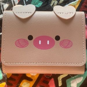 Pink piggy wallet